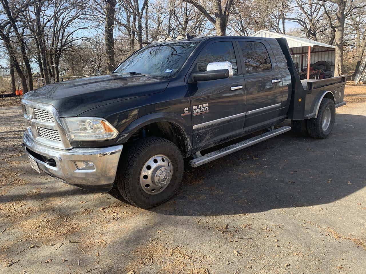 Black Ram 3500 truck with Cummins engine badge visible..